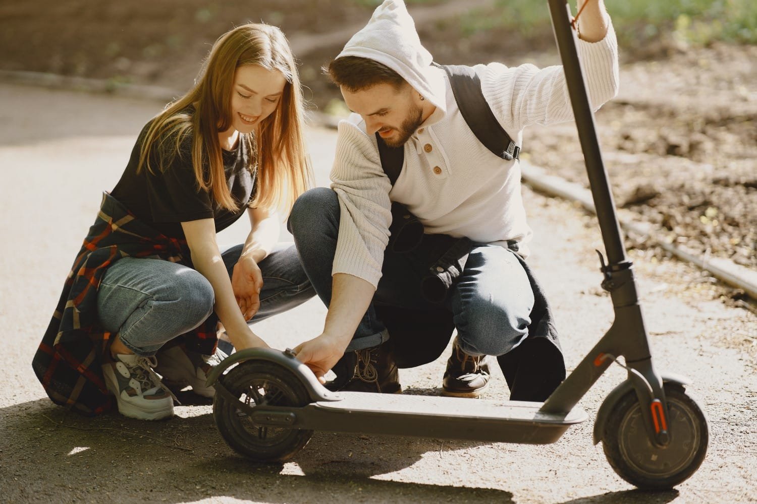 Beautiful couple spend time on a summer forest Electric Scooter Accidents
